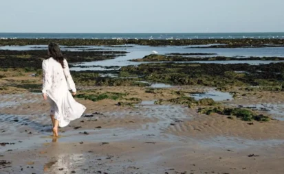 Sarah walking on the beach