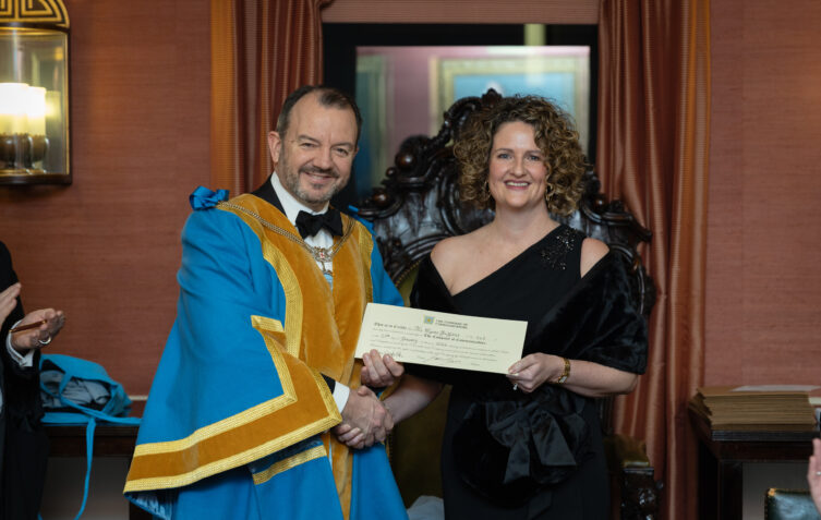 Lynne Ashcroft Griffiths receiving a certificate from the Worshipful Company of Communicators