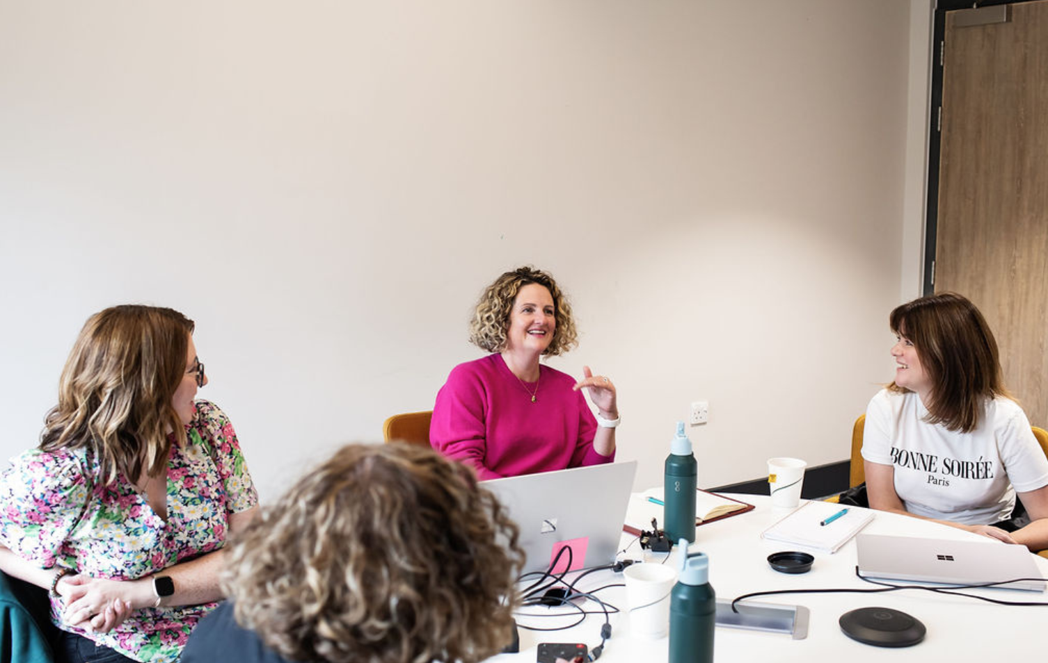 AG Impact team in a meeting